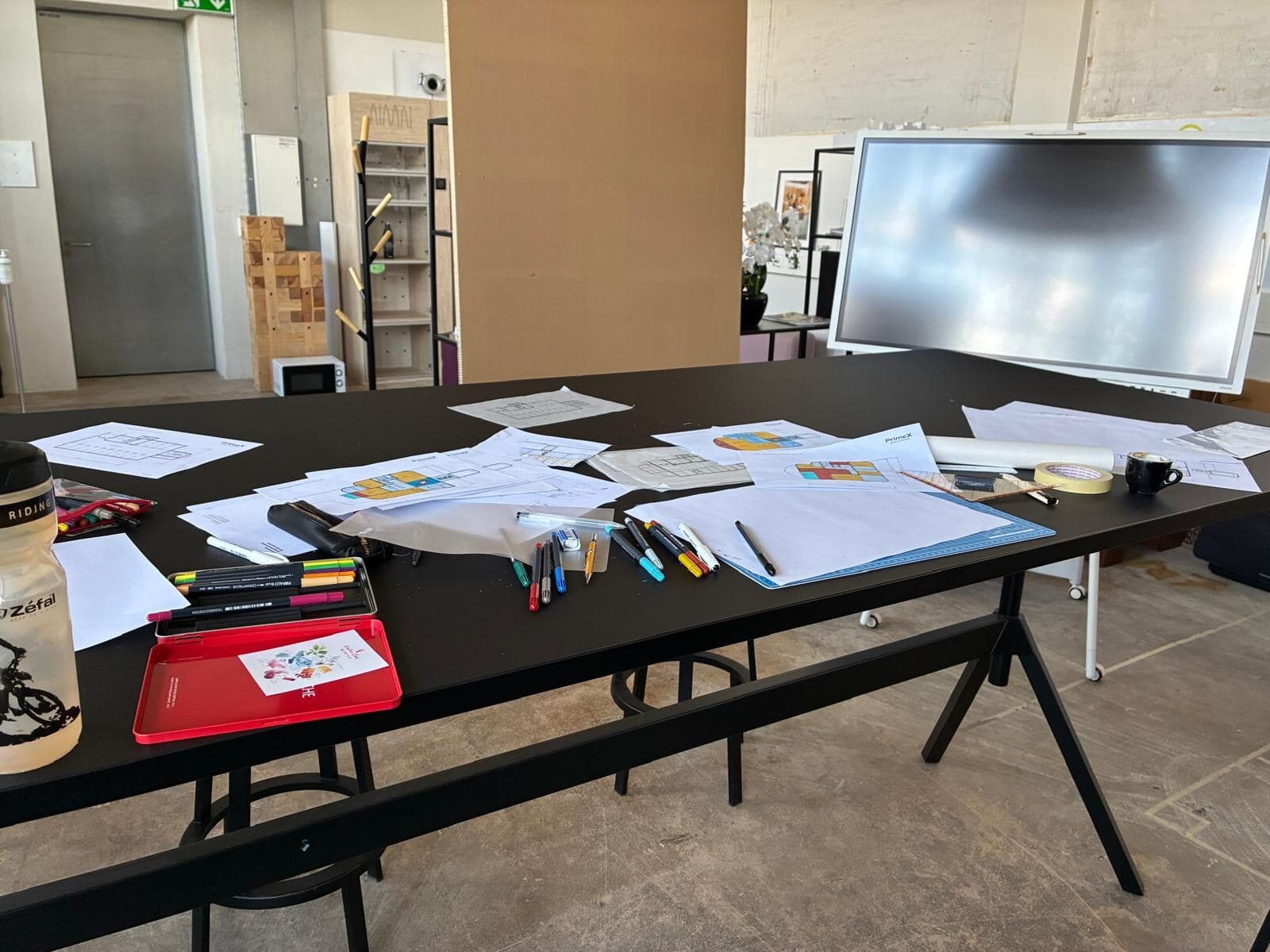 The Swissness ideas workshop — plans and materials on the table in Switzerland